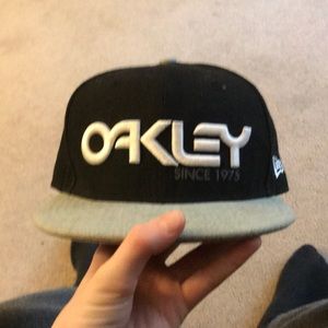 Black and gray Oakley hat
